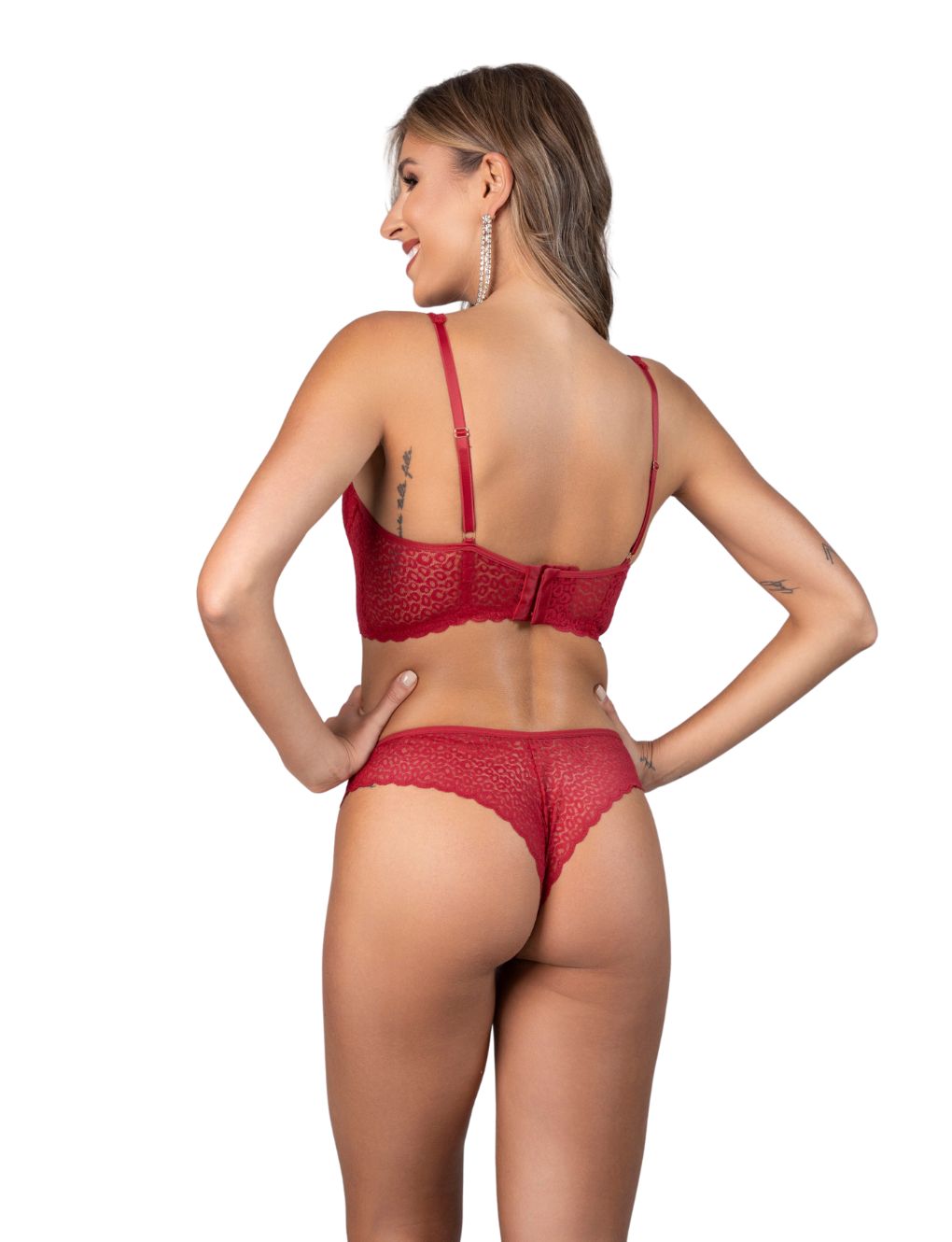 Model wearing Ruby Red animal lace longline bra and matching thong with gold medallion accent. Designed for fuller bust support. From the Sauvage Collection by Secret Kiss.