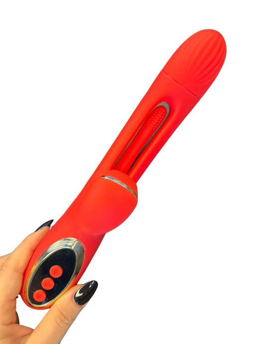 Tapping & Sucking Rabbit Vibrator Secret Kiss in red, held in hand, illustrating its ergonomic design and powerful suction capabilities.