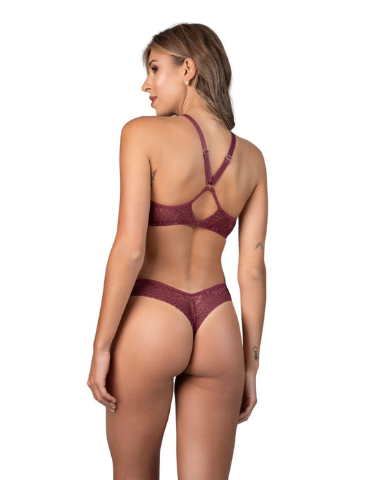 Model in burgundy lace halter set with jewel-accented bra and ring-detailed cut-out thong. Secret Kiss lingerie look.