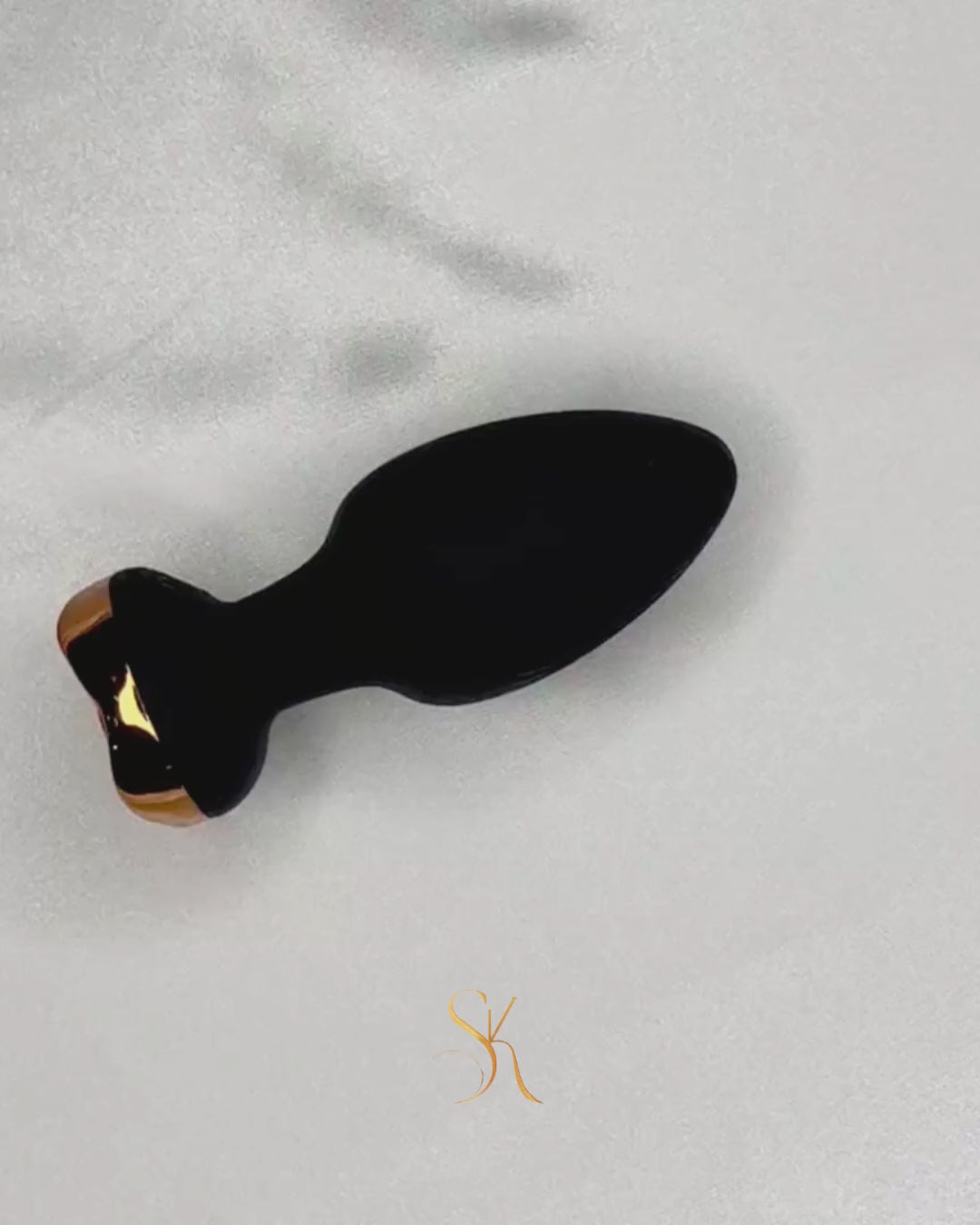 Wireless Prostate and Anal Vibrator Secret Kiss rotating to display shape, texture, and wireless functionality.